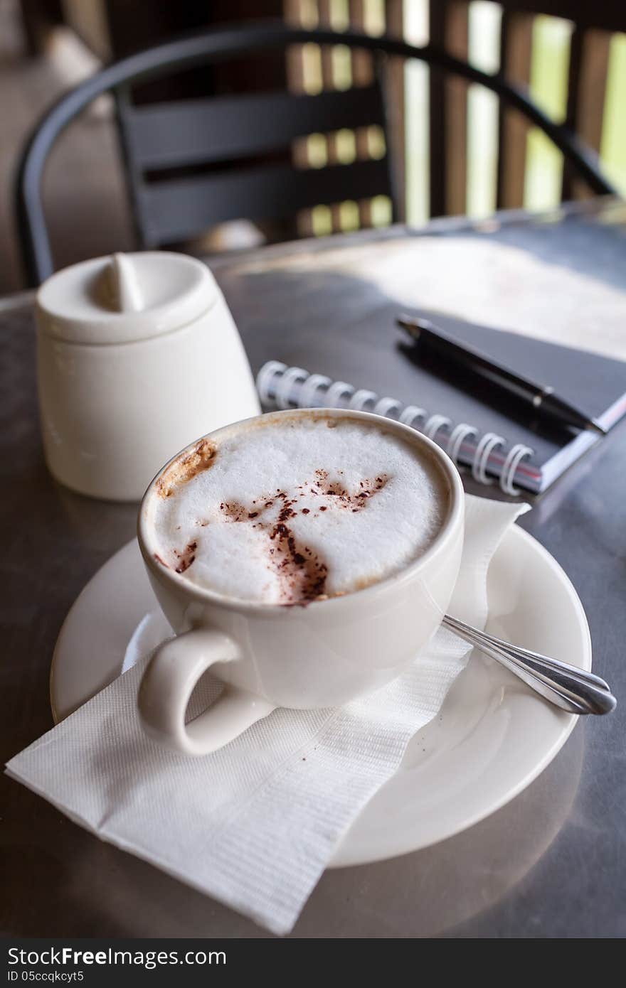 A cup of coffee on a desk