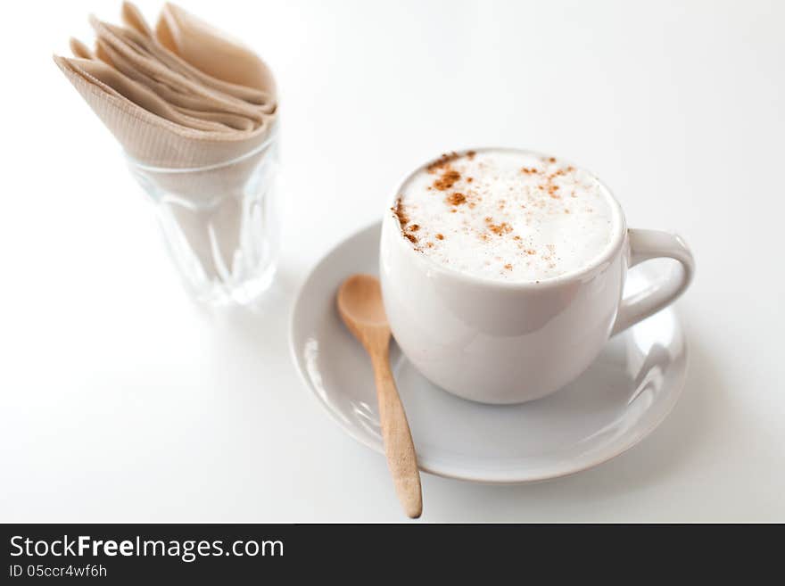 A cup of coffee on a white desk