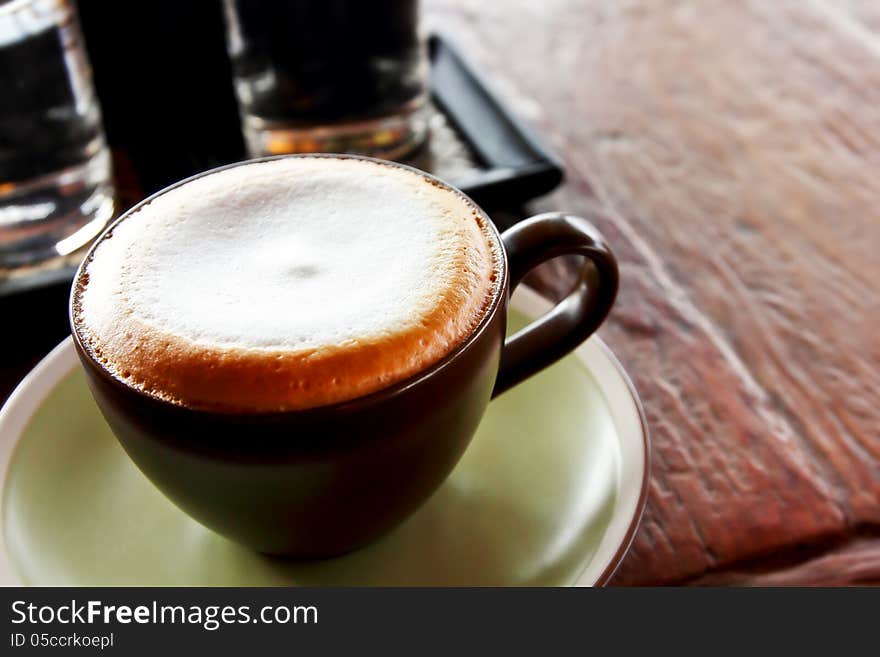 Cappuccino hot on wooden table. Cappuccino hot on wooden table