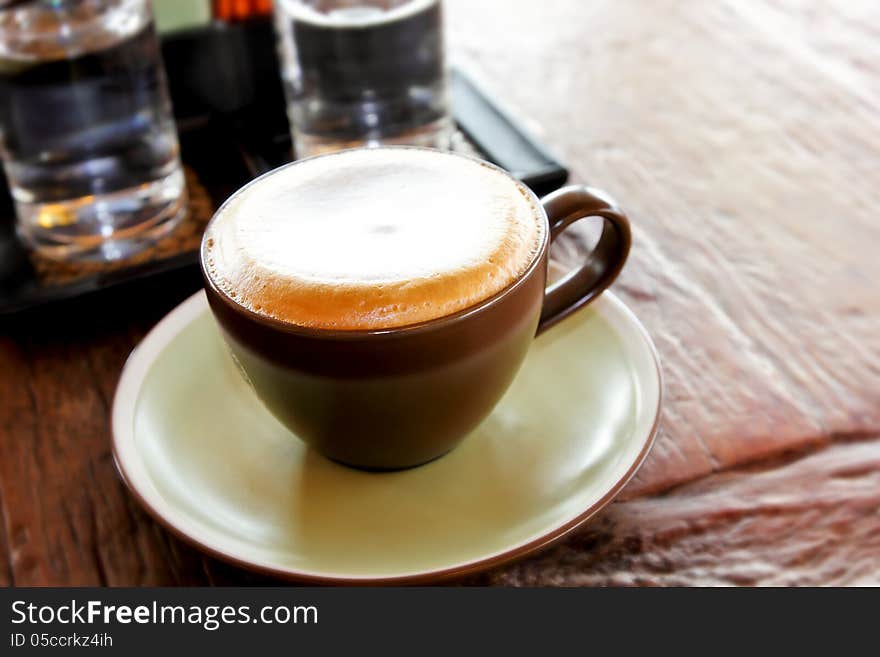 Cappuccino on wooden table,food and drink background. Cappuccino on wooden table,food and drink background