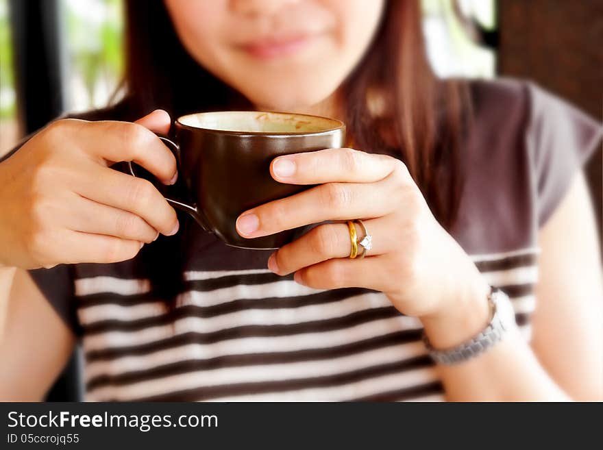 Woman Drinking Coffee At Rest