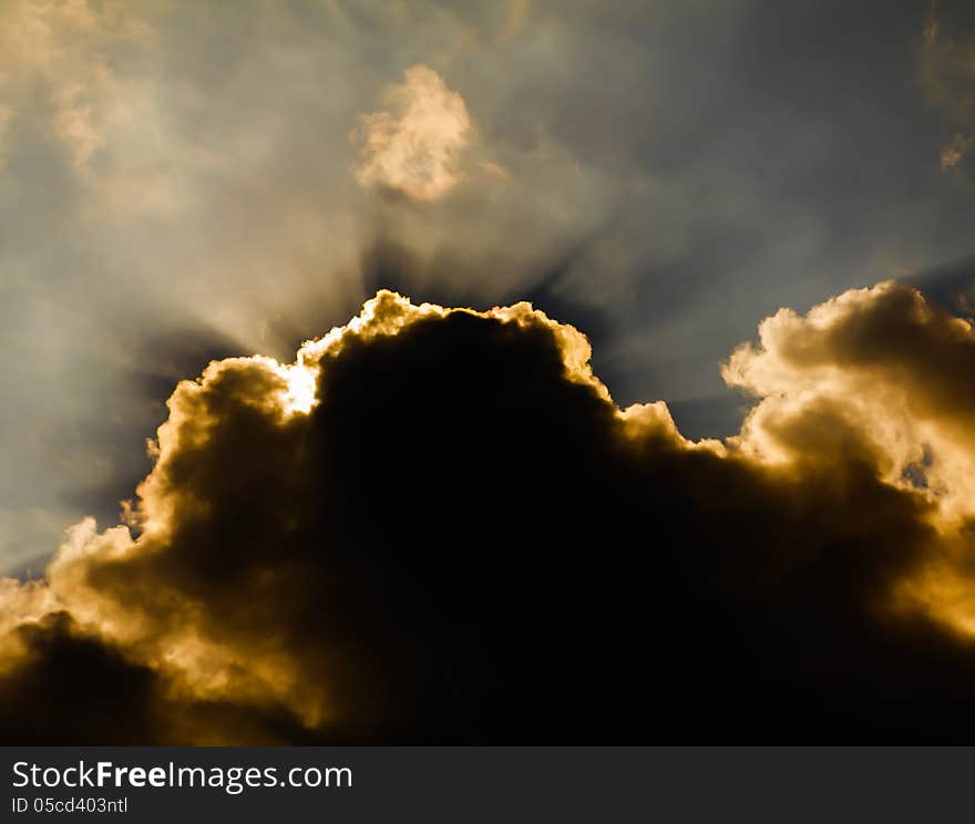 Sun shine through rain cloud