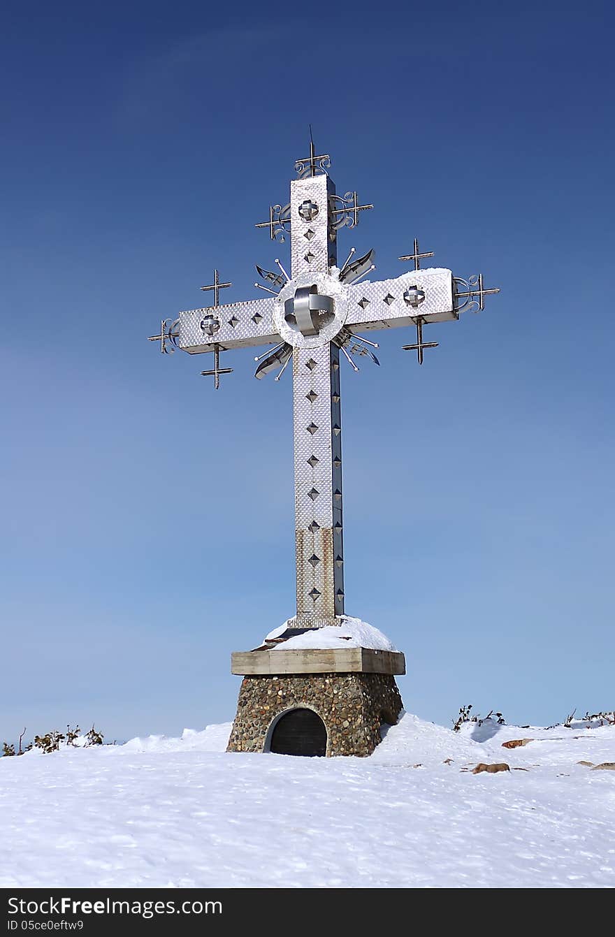 Cross on top of a mountain in the Sheregesh