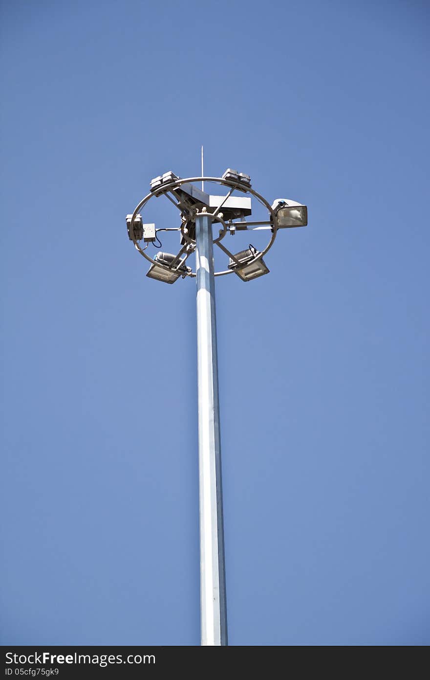 A six way street lamp under the blue sky
