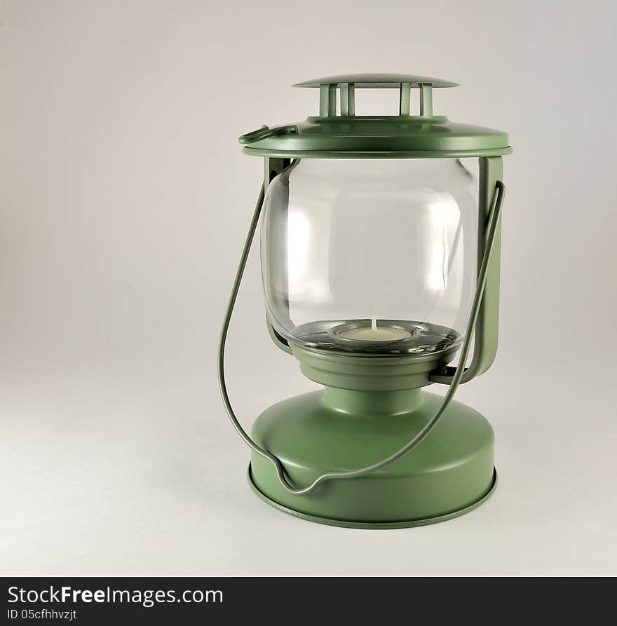 Portable lamp with a candle