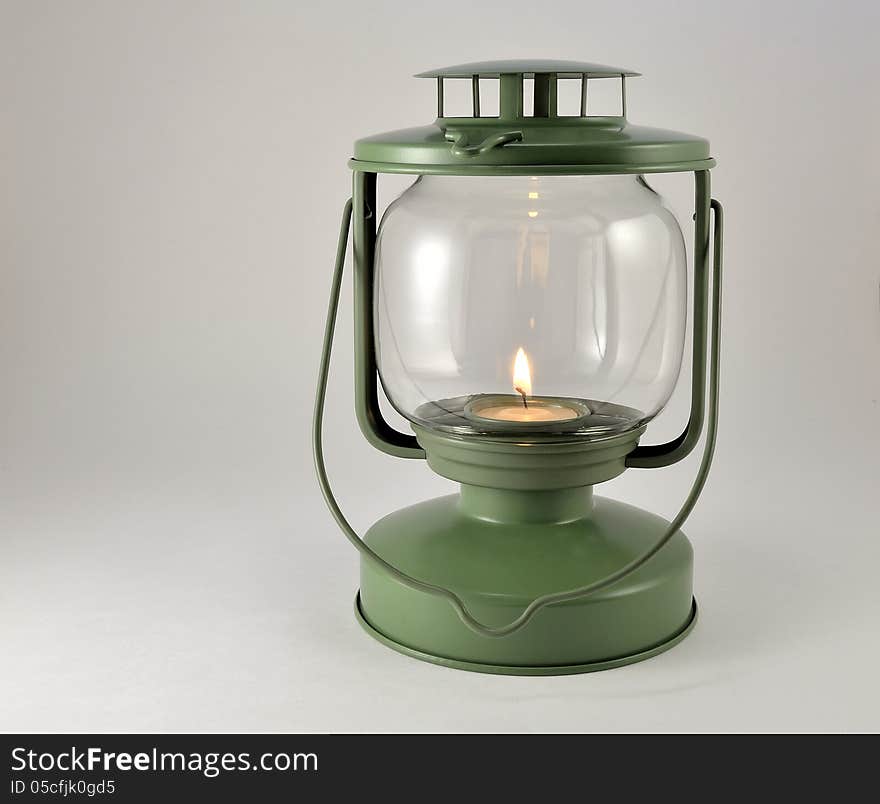 Portable lamp with a candle