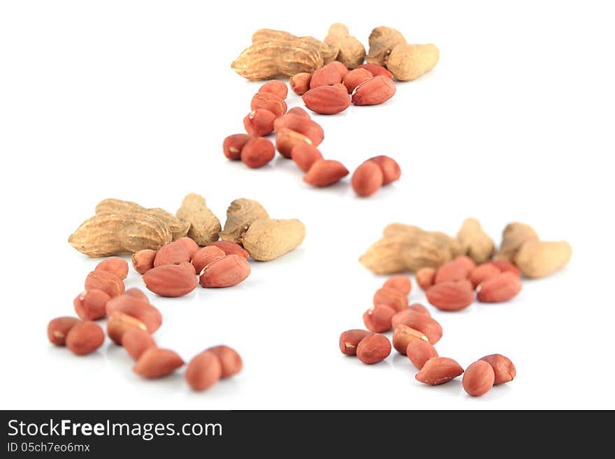 A lot of Peanuts (Three action Peanuts) on isolated over white background. A lot of Peanuts (Three action Peanuts) on isolated over white background.