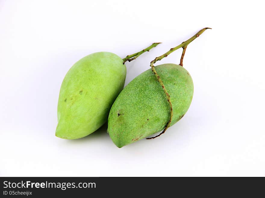 A Green mango on white Background.