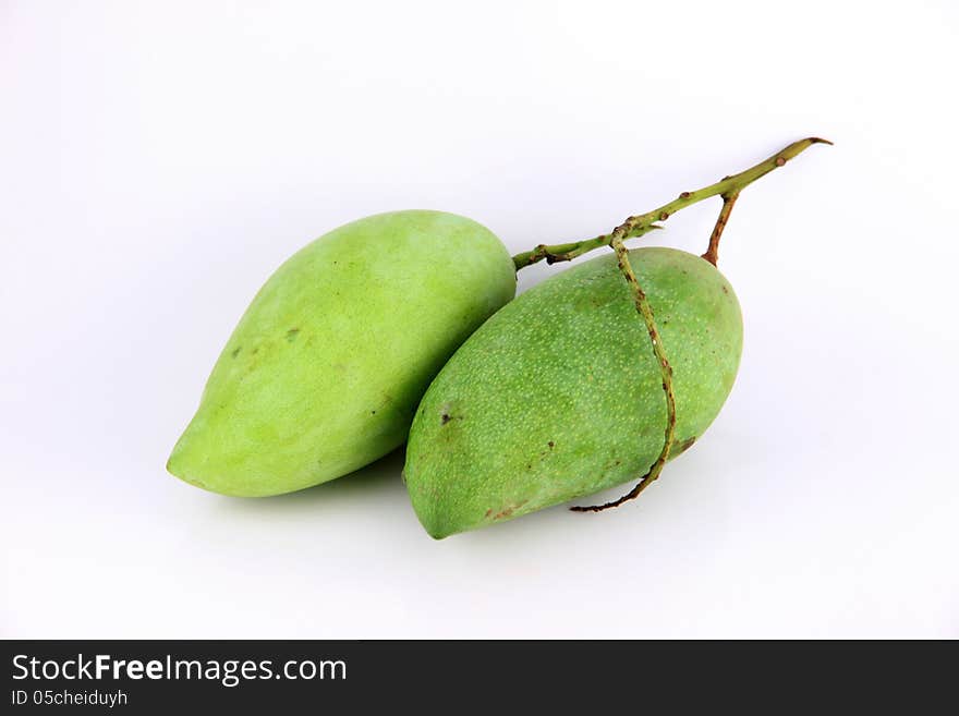 A Green mango on white Background.