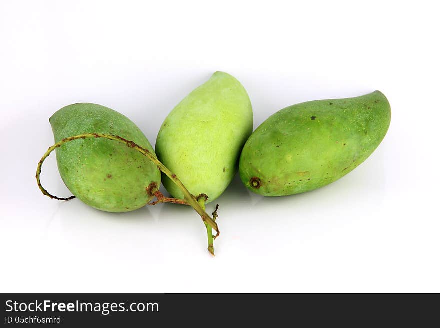 A Green mango on white Background.