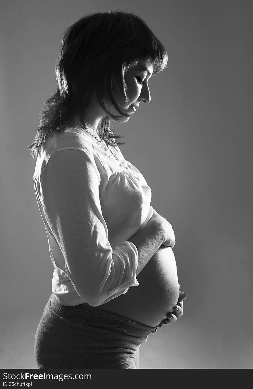 Young pregnant woman black and white