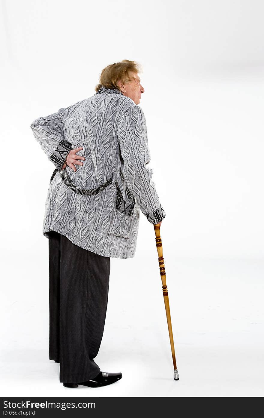 Full length portrait of old man with a cane