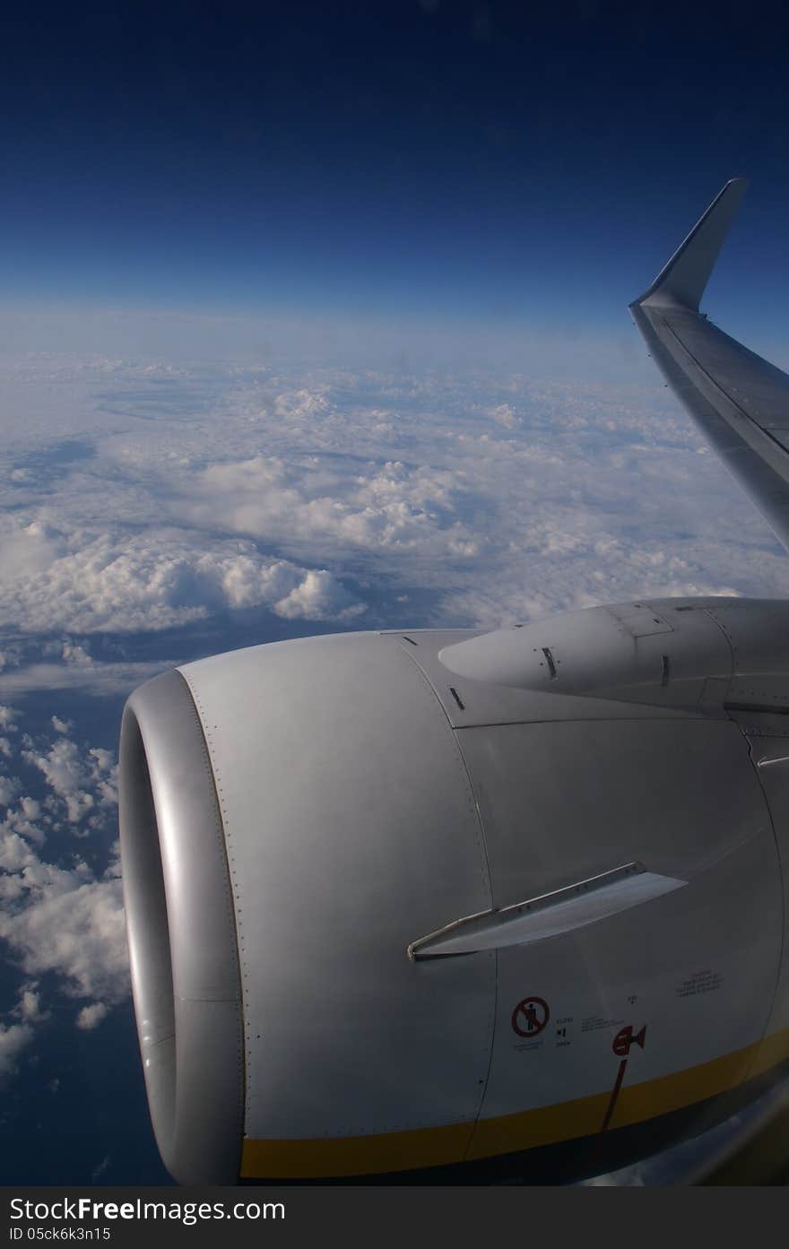 View of clouds and land from plane window. View of clouds and land from plane window