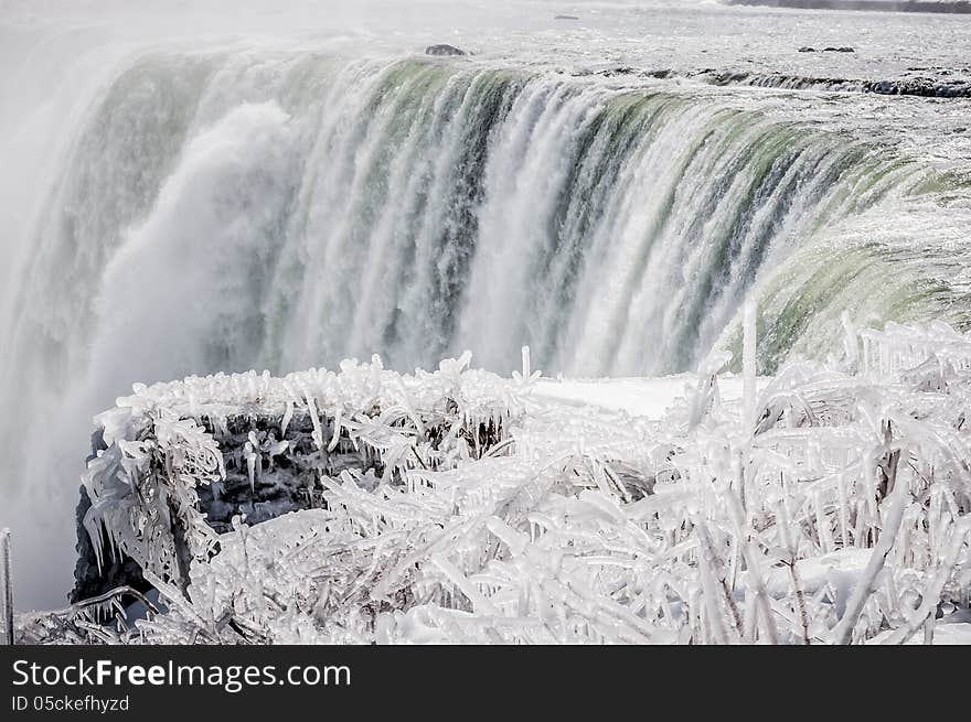 Niagara falls on a snowy landscape on winter time