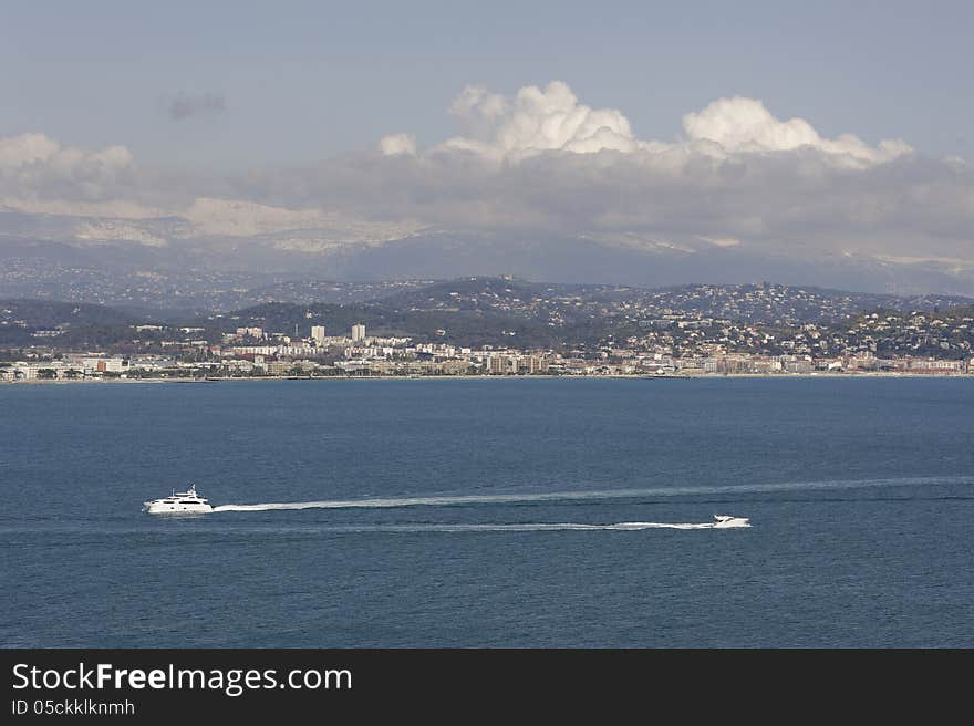 Image taken in the Cote d`azure, France, 2013. This image shows some of the classic ingredients of the French Riviera including the Mediterranean sea, mountains and boats. Image taken in the Cote d`azure, France, 2013. This image shows some of the classic ingredients of the French Riviera including the Mediterranean sea, mountains and boats