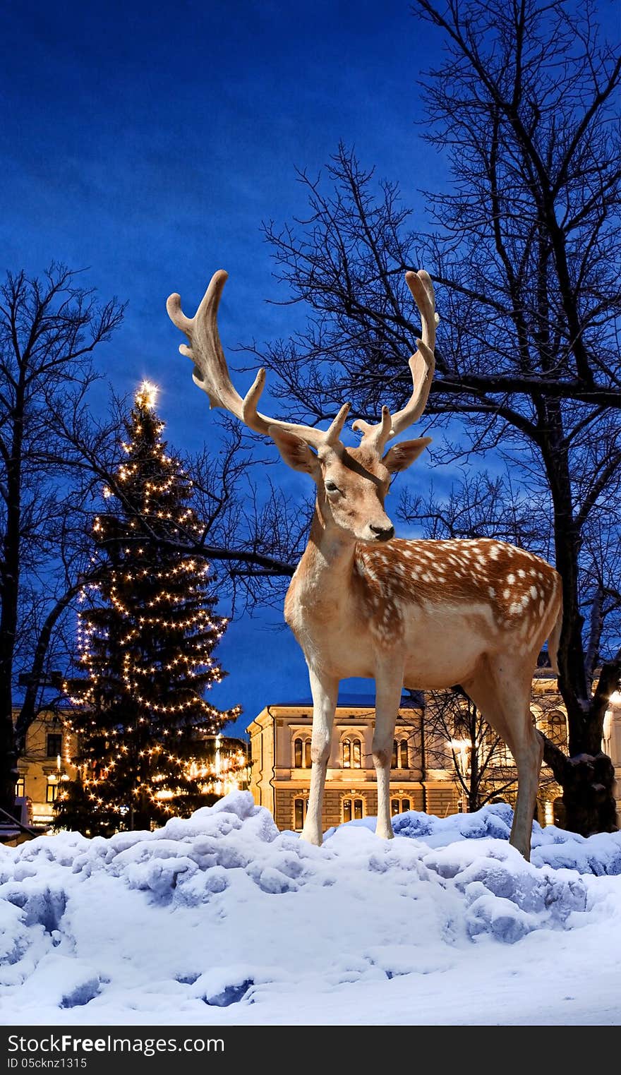 Christmas deer small town Xmas tree background. Christmas deer small town Xmas tree background