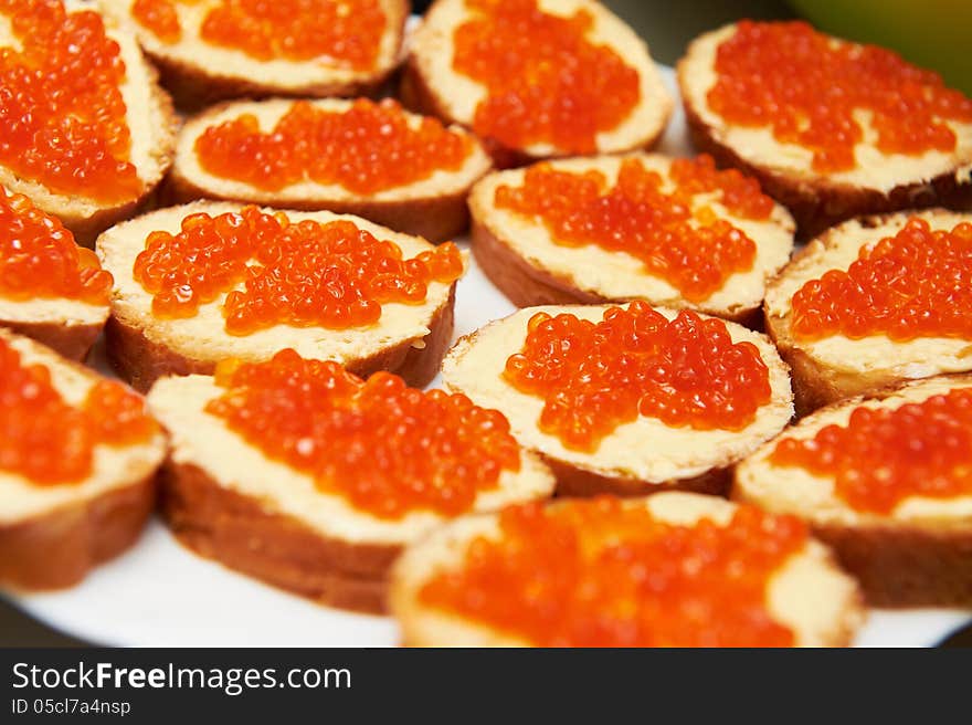 Sandwich with caviar at holiday table