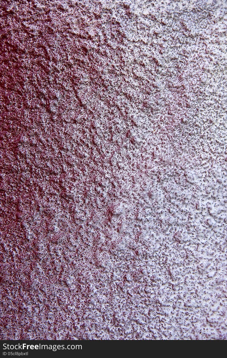 Detail red-sprayed wall, roughcast. Detail red-sprayed wall, roughcast