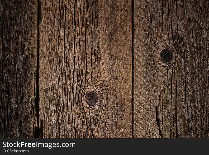 Background for design. The texture of old wood with cracks and knots