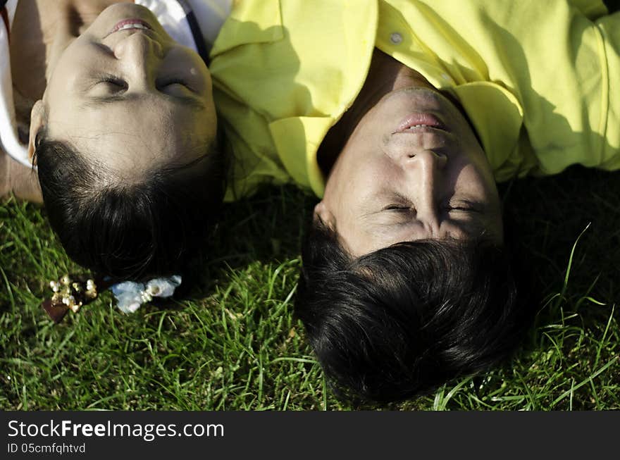 Seniors Couple Lying On Grass