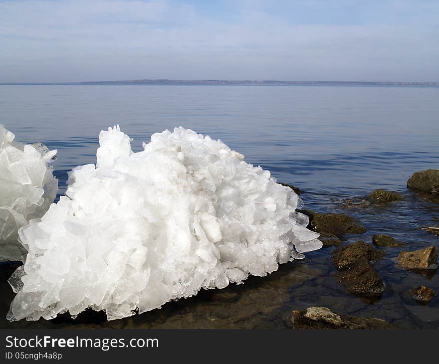 Broken ice on water background