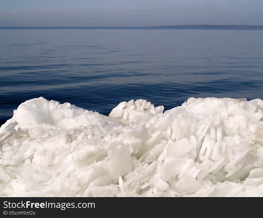 Broken ice on water background