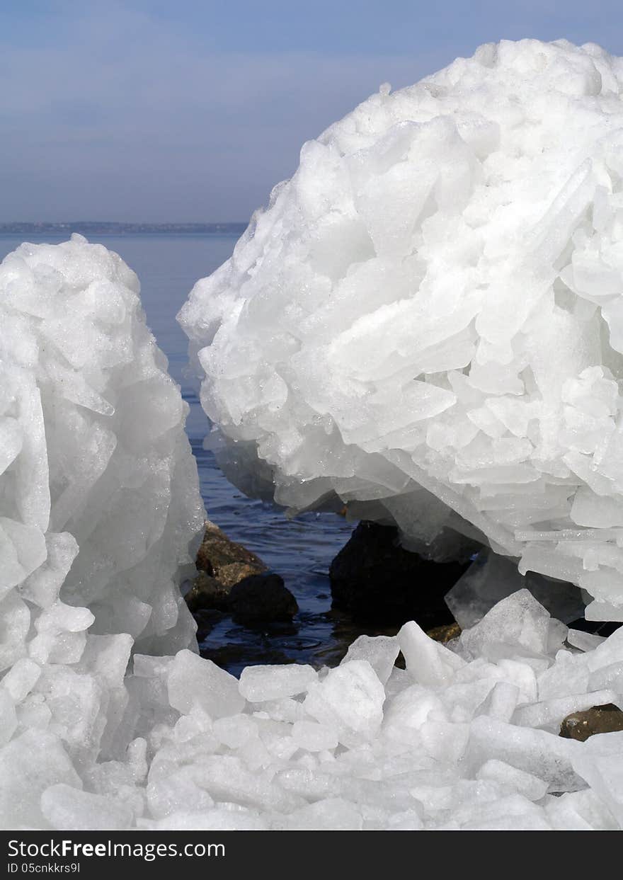 Broken ice on water background