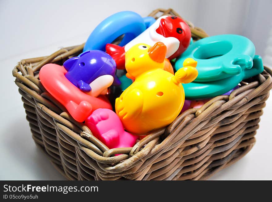 Knitting basket filled with toys. Knitting basket filled with toys