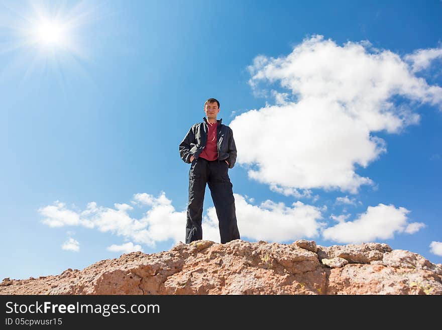 Man Standing On A Rock