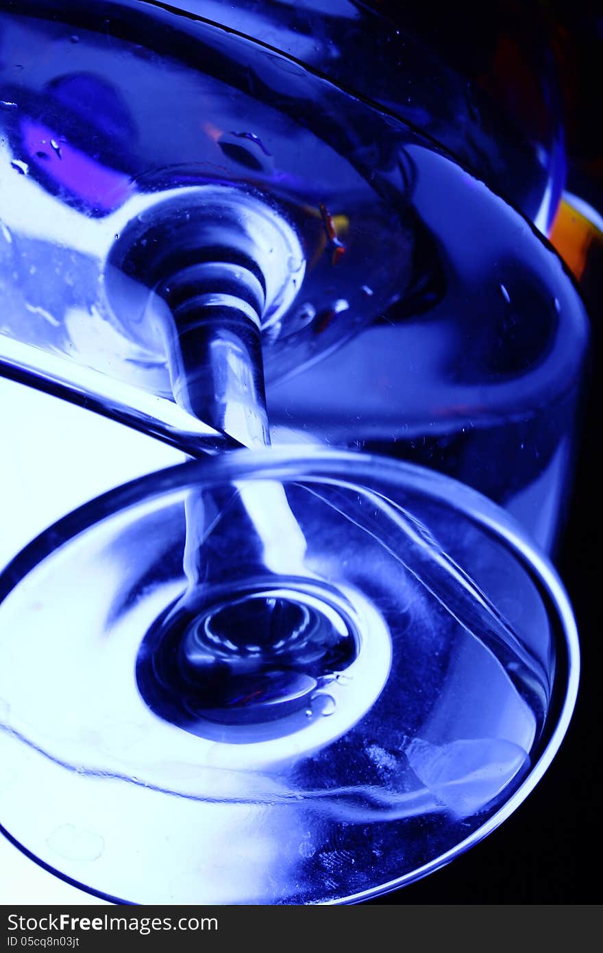 Creativity close-up of wineglass with multicolor glass bubbles and water on white background. Creativity close-up of wineglass with multicolor glass bubbles and water on white background