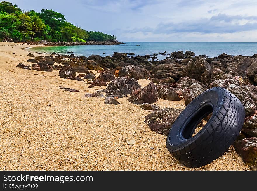 Washed out tyre at beautiful ocean coast in Andaman sea