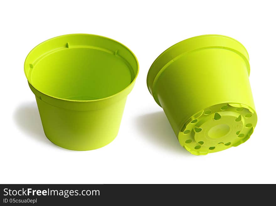 Two plastic plant pots isolated on a white background