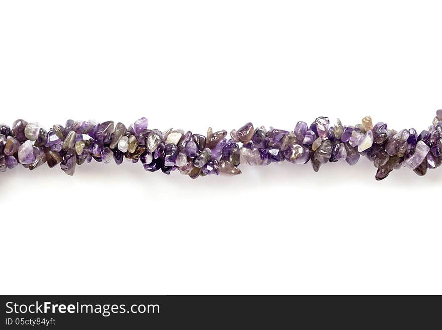 Thread of amethyst bead isolated over white