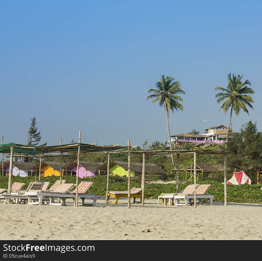 Empty sunbeds on Mandrem beach in Goa India