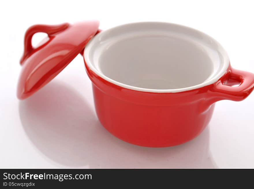 Ceramic, red pan on white background