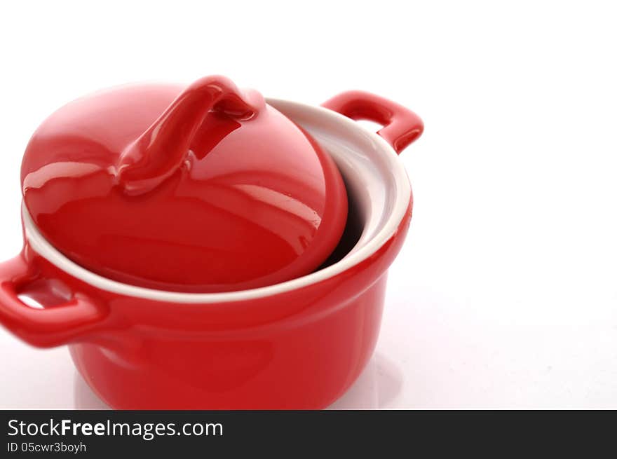 Red ceramic pan on white background. Red ceramic pan on white background