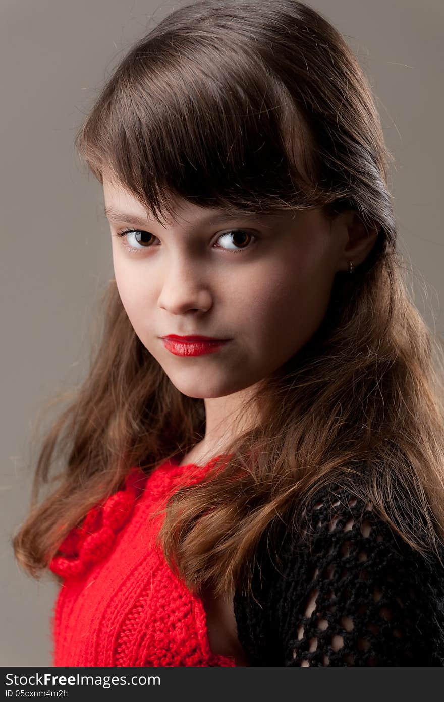 Portrait of young girl in a red dress. Portrait of young girl in a red dress