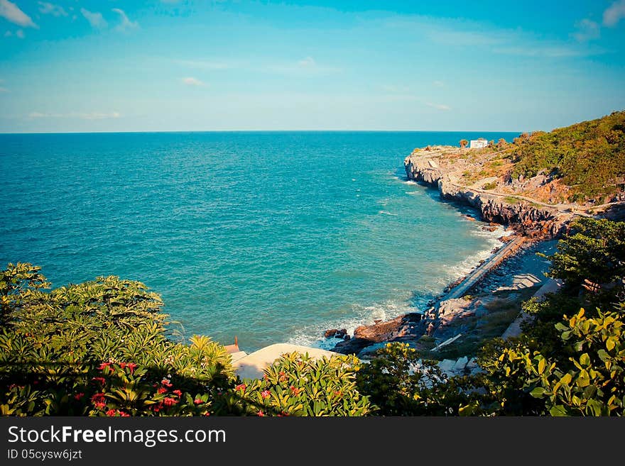 Rock coast in a sea with blue sky. Rock coast in a sea with blue sky