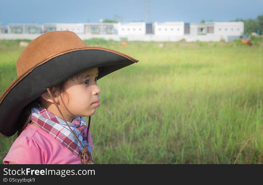 A Cowgirl On A Field