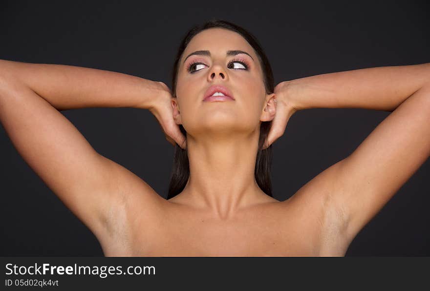 Woman Looks To The Side While Dressing And Creating Hairstyle