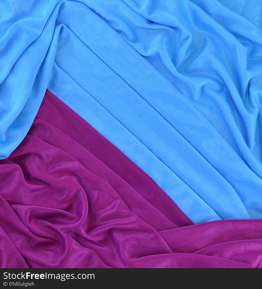 Background of blue and lilac fabric with wrinkles. Background of blue and lilac fabric with wrinkles