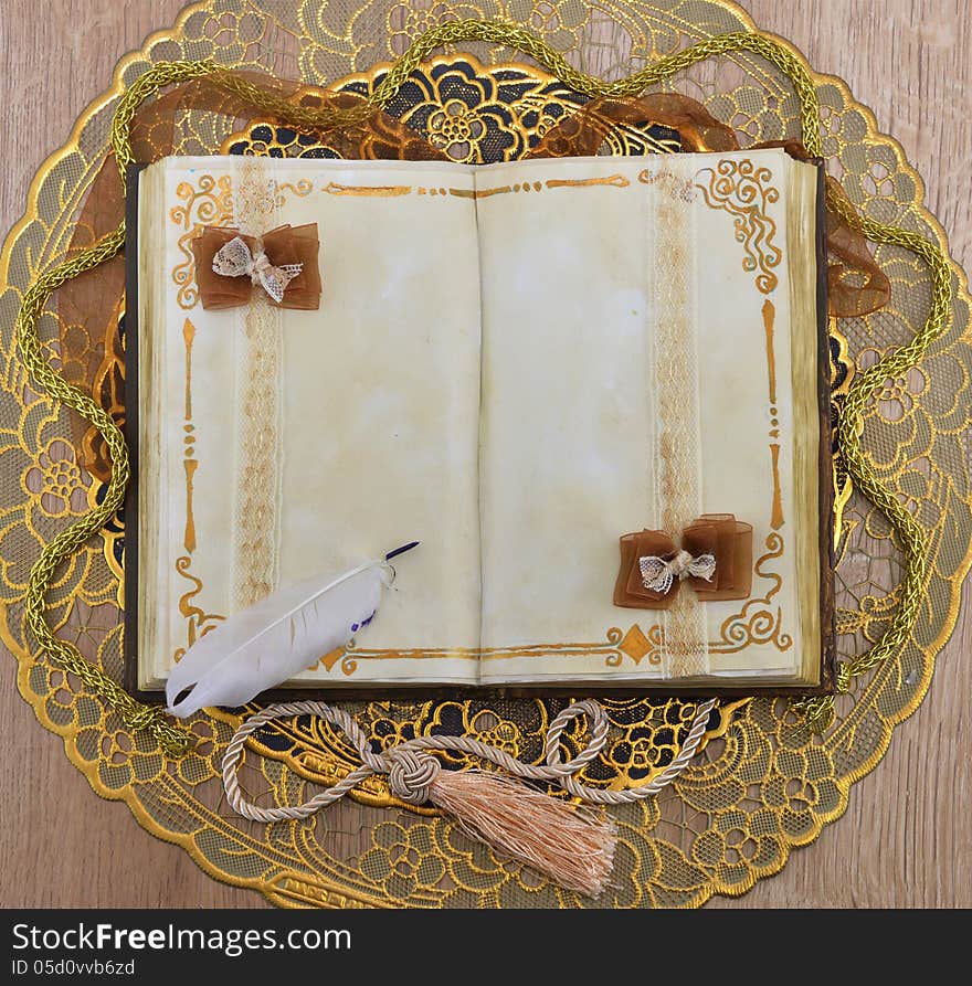 Open book with space for text on the golden napkin. Open book with space for text on the golden napkin