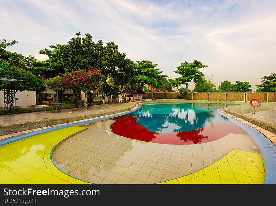 Indonesia Bali Benoa.Crystal clear swimming pool,flower trees,colorful.