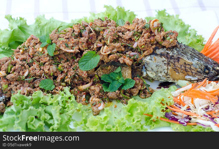 Crispy snake-head fish fried with spicy salad. Crispy snake-head fish fried with spicy salad