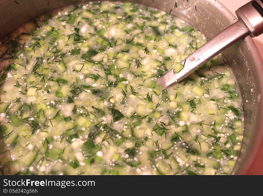 Dish of fresh okroshka with spoon