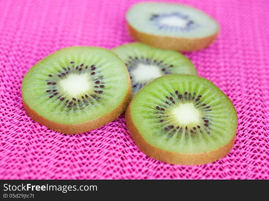 Kiwi fruit on pink background