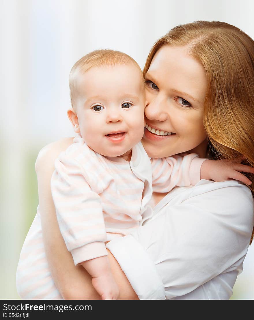 Happy Family. Young Mother With Baby