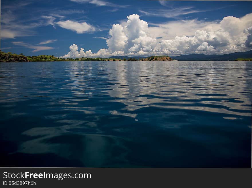 Multicolor sky, transparent sea and islands on archipelago Flores, Indonesia. Multicolor sky, transparent sea and islands on archipelago Flores, Indonesia