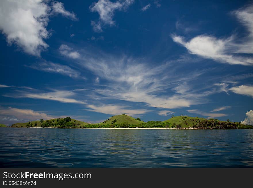 Multicolor sky, transparent sea and islands on archipelago Flores, Indonesia. Multicolor sky, transparent sea and islands on archipelago Flores, Indonesia