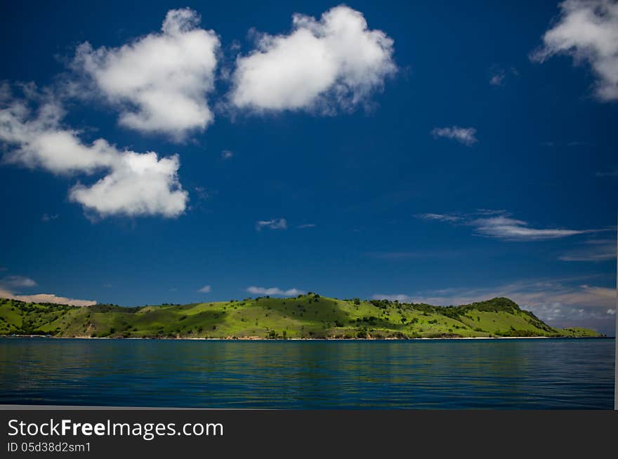 Multicolor sky, transparent sea and islands on archipelago Flores, Indonesia. Multicolor sky, transparent sea and islands on archipelago Flores, Indonesia